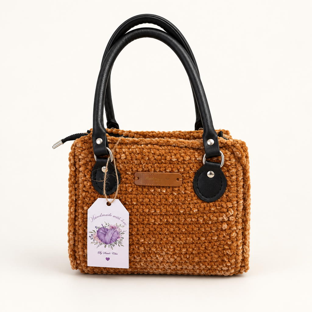 Bearbeitetes Produktfoto der karamellbraunen Tasche mit schwarzen Henkeln